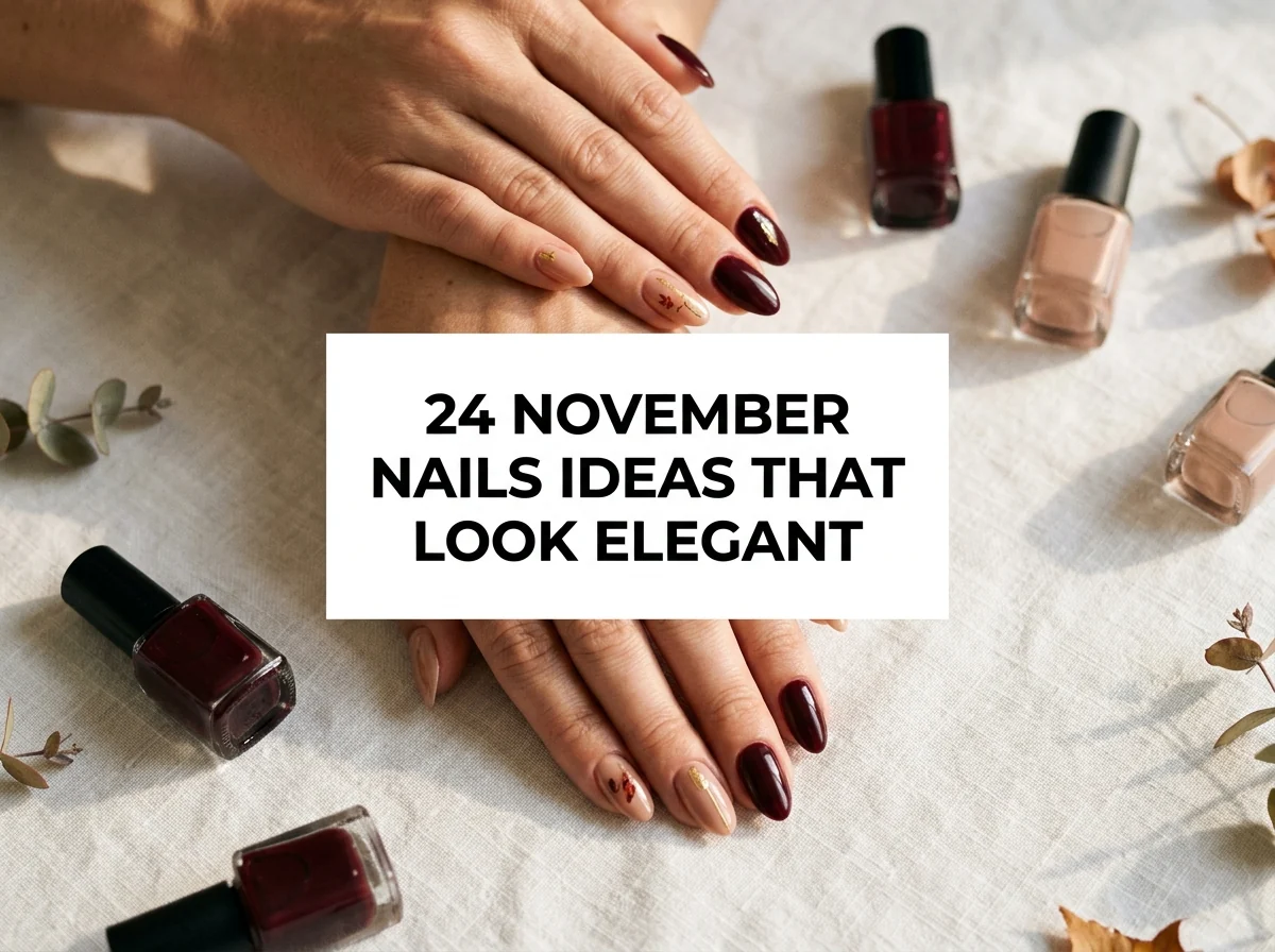Elegant burgundy manicure with delicate gold and leaf accents.